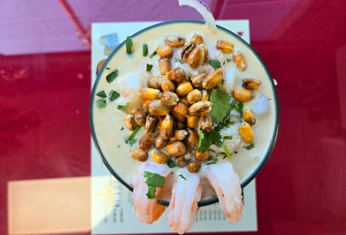Leche de tigre with shrimp hanging off the side