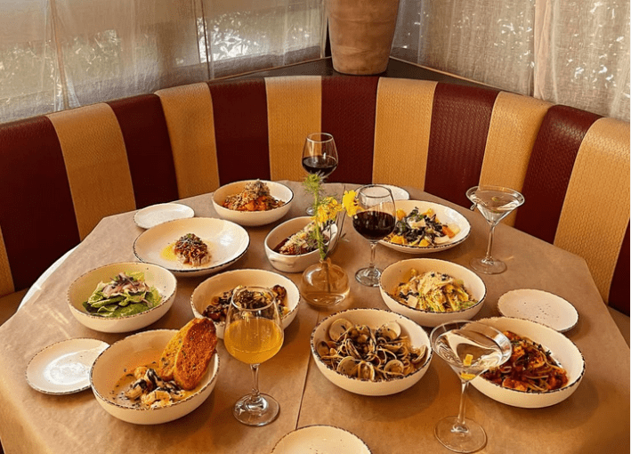 A table loaded with Italian classics like vongole with littleneck clams at Sal's Place.