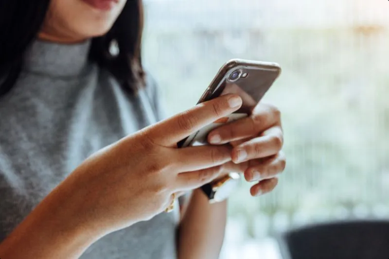 A woman holding a cellphone