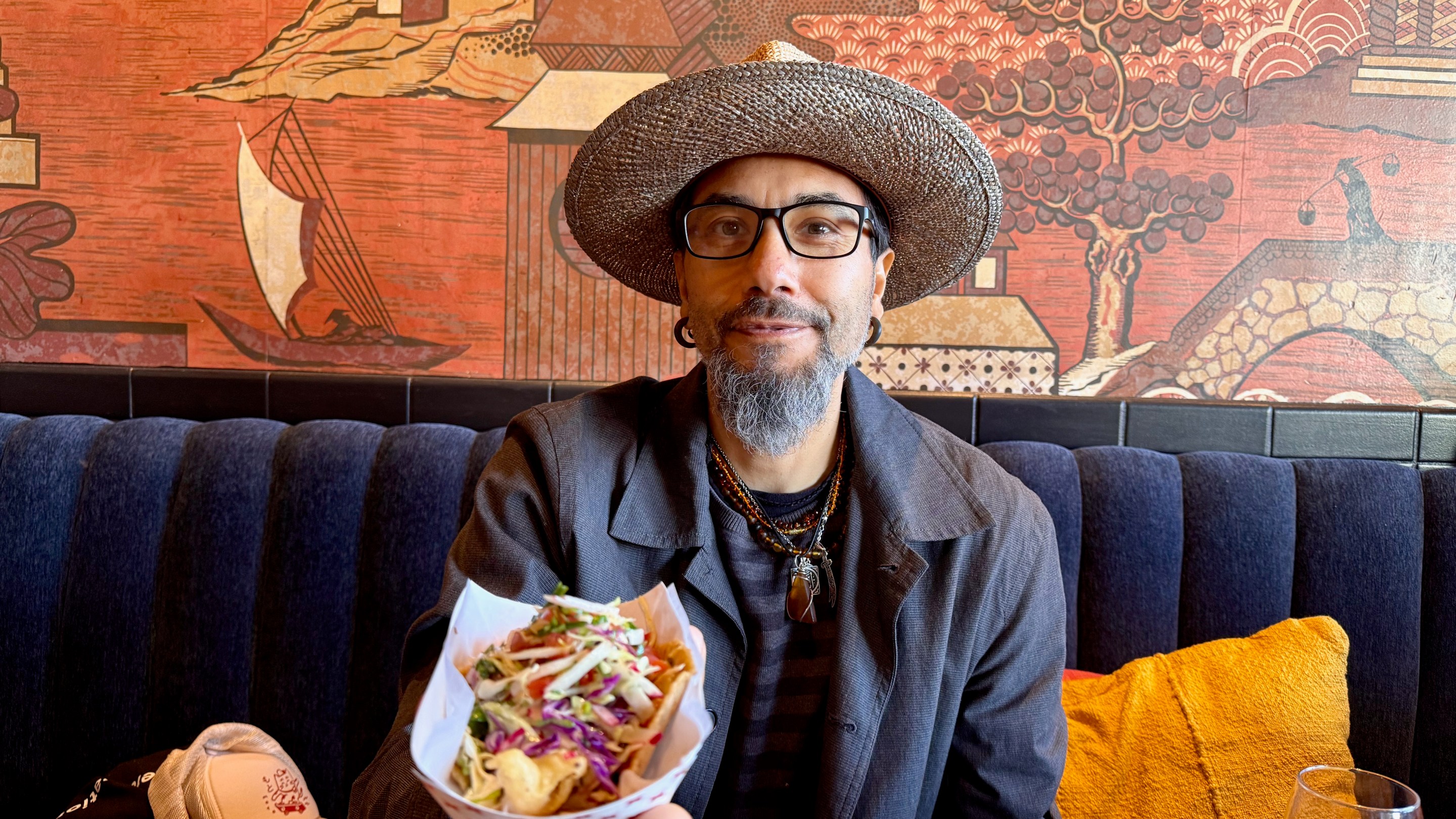 Chef Josh Gil holding up his albacore tostada.