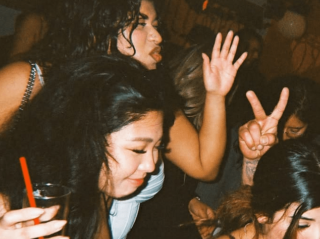 A group of girls dancing at Palenque at Bar CDMX.