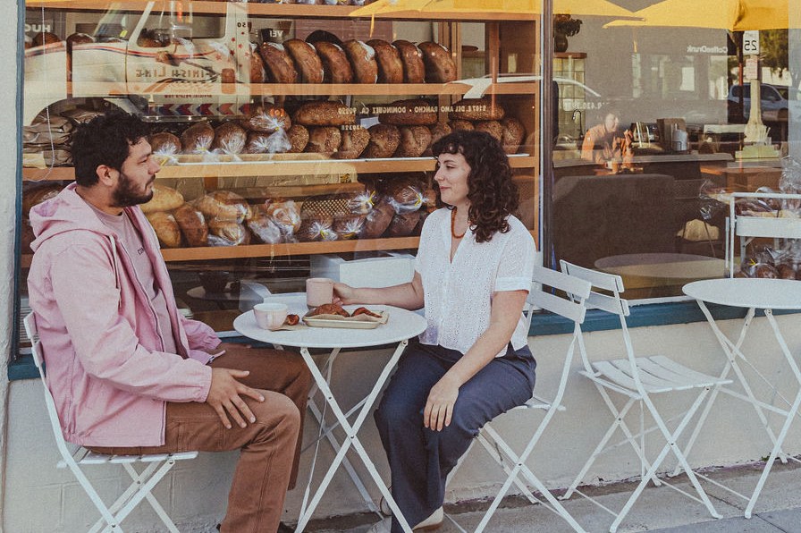 Arturo Enciso and Ana Salatino sit in front of their Gusto Bread in Long Beach.