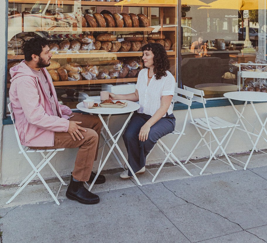 Arturo Enciso and Ana Salatino sit in front of their Gusto Bread in Long Beach.