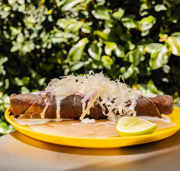 Deep fried fish flauta from Ditroit with cheese, sour cream and avocado salsa.