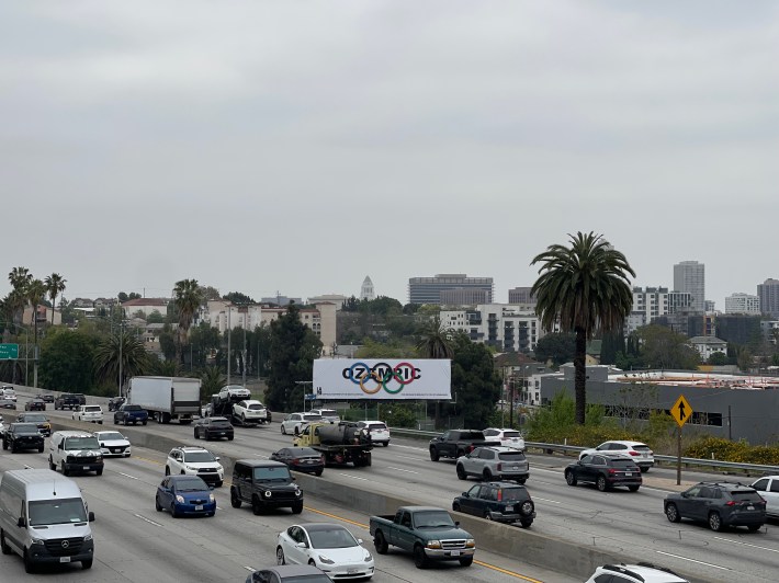 Cars fill the 101 Freeway with the Ozempic billboard in the background.