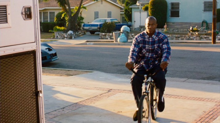 Deebo, played by Tommy Lister Jr. on a bike.