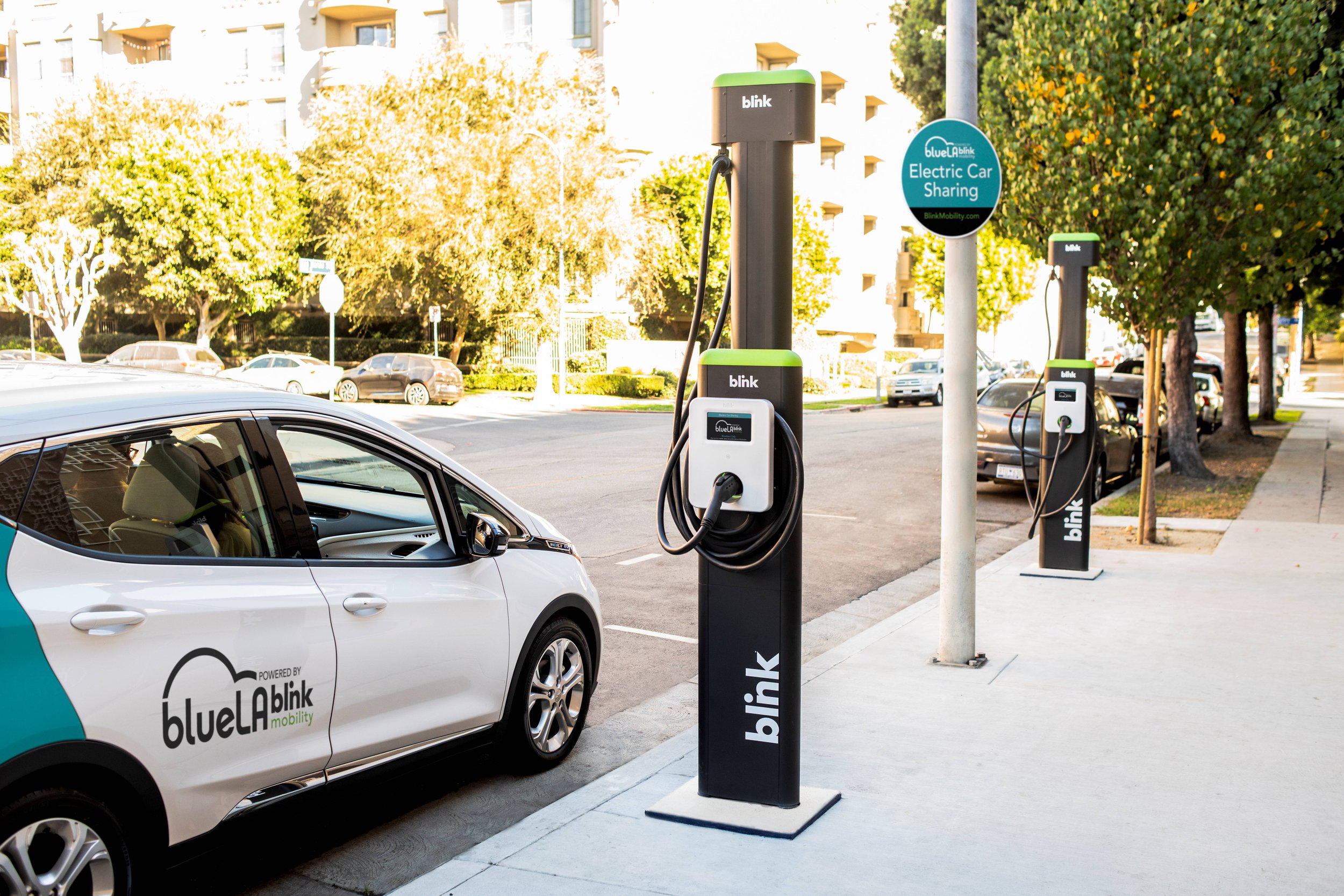 A BlueLA car sits at a BlueLA charging station.