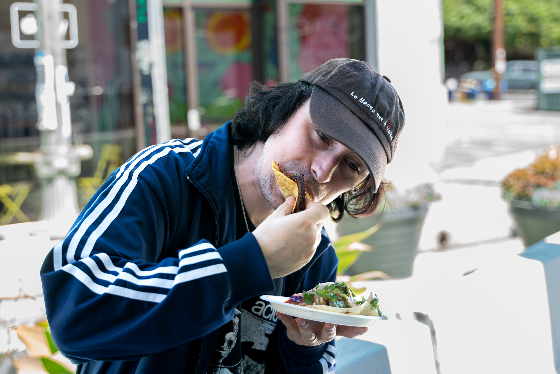 Depresion Sonora taking a bite of tacos.