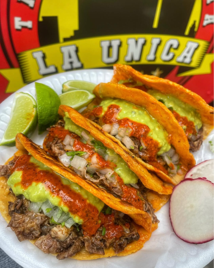 Quesabirria de Chivo at La Unica, topped with red salsa, cilantro, onion and guacamole.