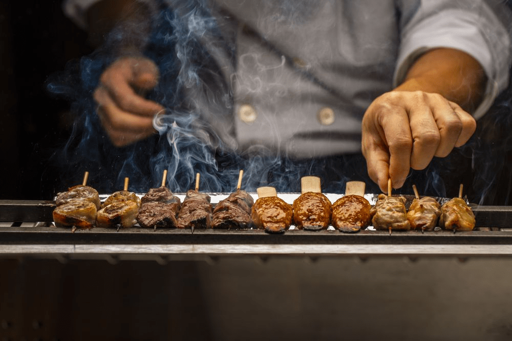 Kushiyaki grilling on binchotan at Saijo.