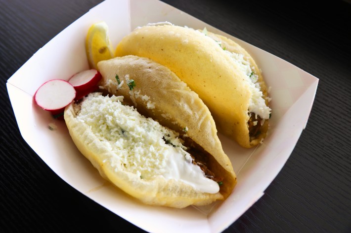 Puffy taco at Fat Burrito stuffed with stewed machaca and a chile verde gisado.