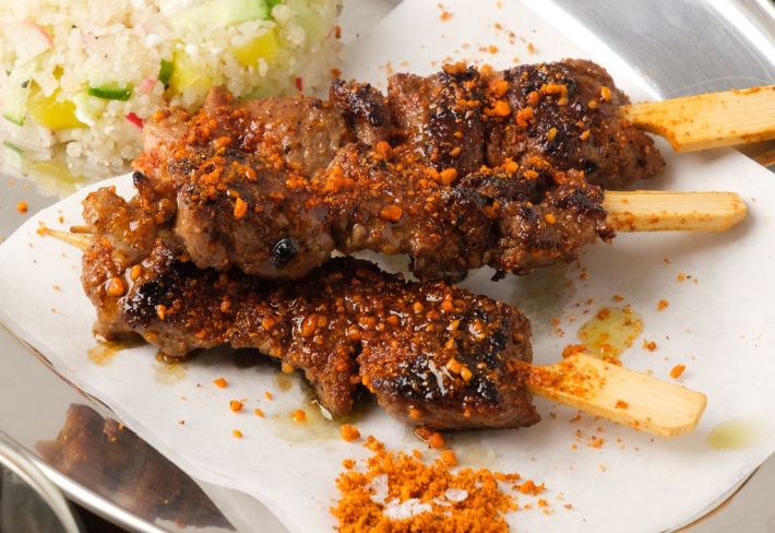 Three yaji-spiced rosemary lamb suya skewers at Jikoni.