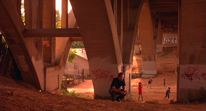 A grown Jimmy (Jimmy Smits) returns to the spot of Chucho’s death. Screenshot via New Line Cinema.