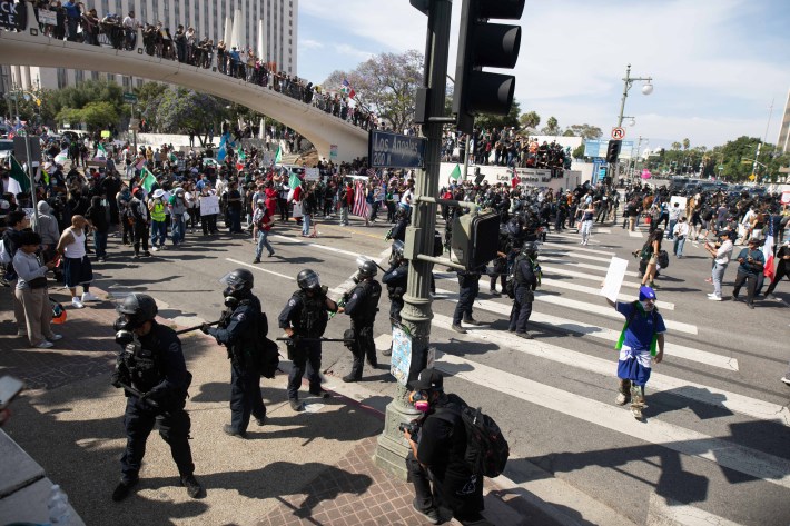 Police line up facing protestors in Downtown LA