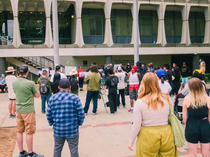 The backs of a crowd rallying in support of jailed journalist Anthony Orendoff