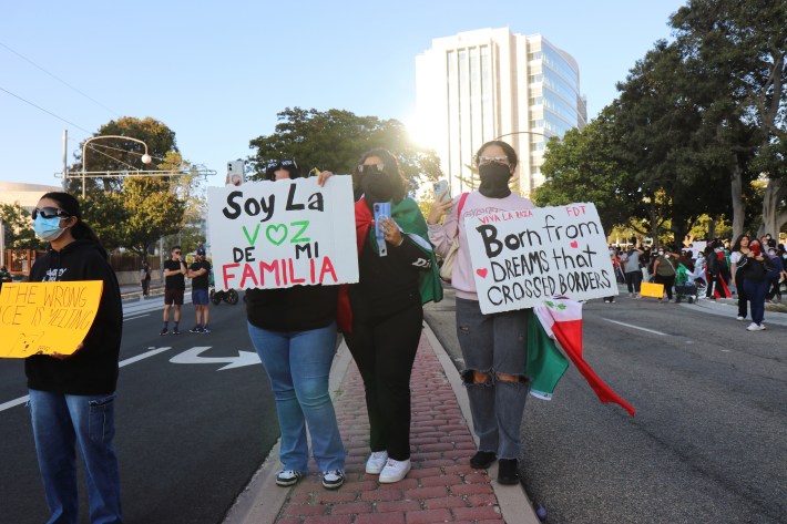 Protest in Santa Ana California people holding signs
