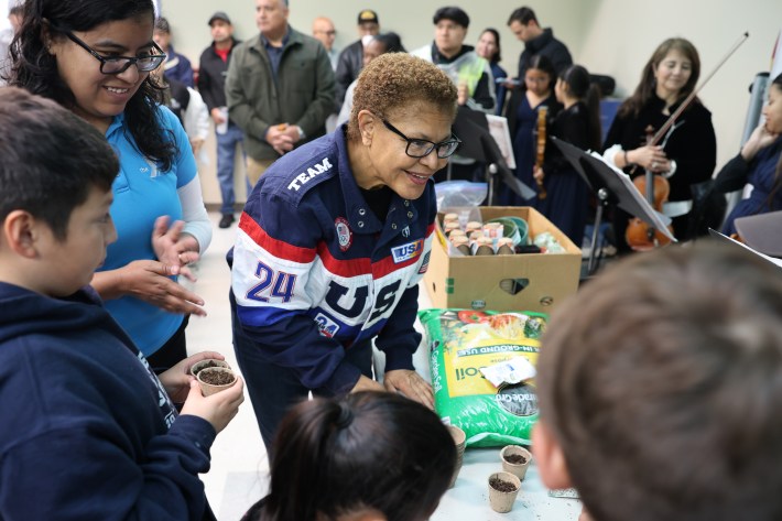Mayor Karen Bass at the inaugural Shine LA event in April 2025, bending towards people