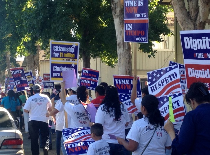 Protestors with SIREN holding signs that says Respeto, Citizenship For 11 Million, and Time Is Now