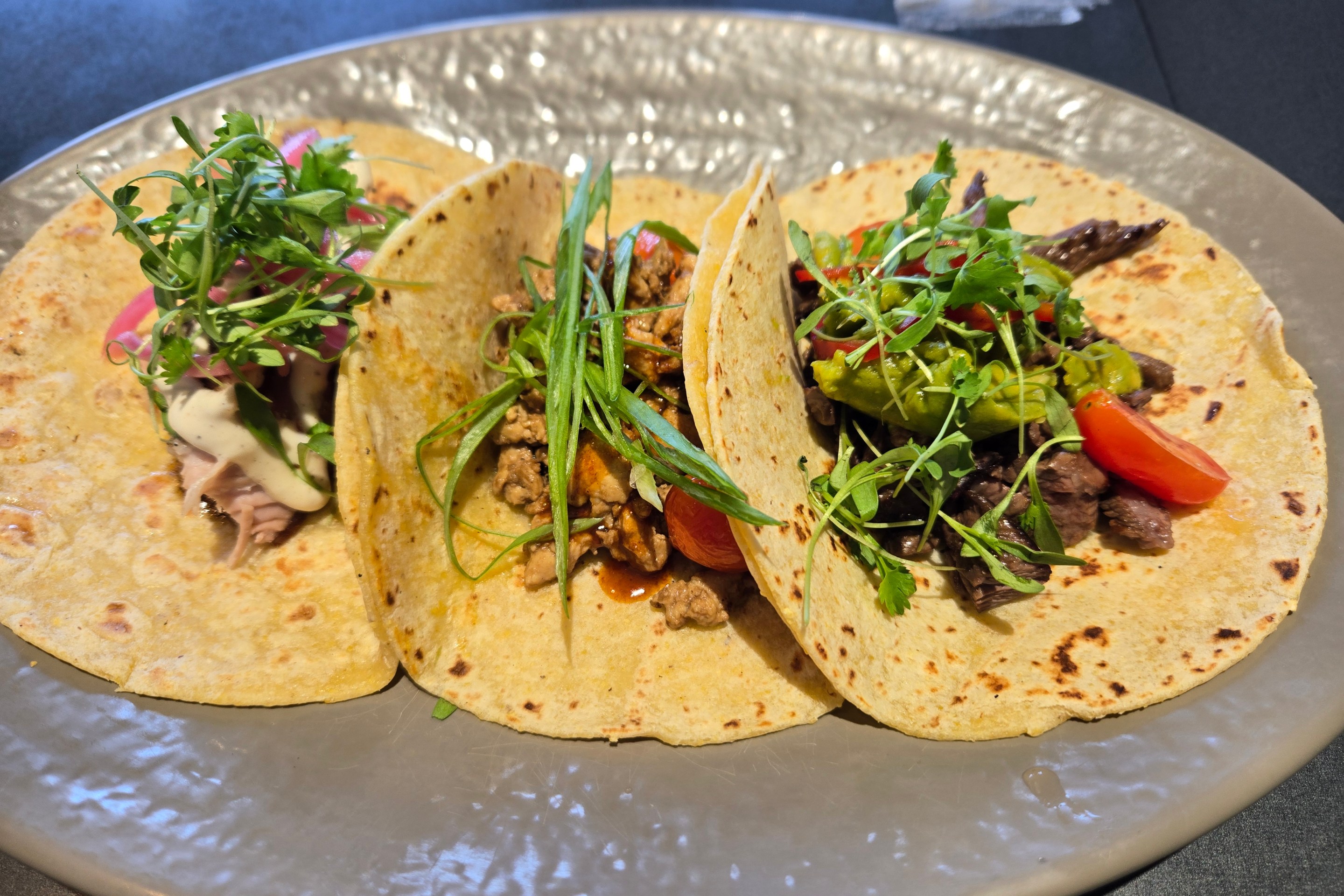 3 Filipino tacos at Spoon & Pork, open-faced, on a plate