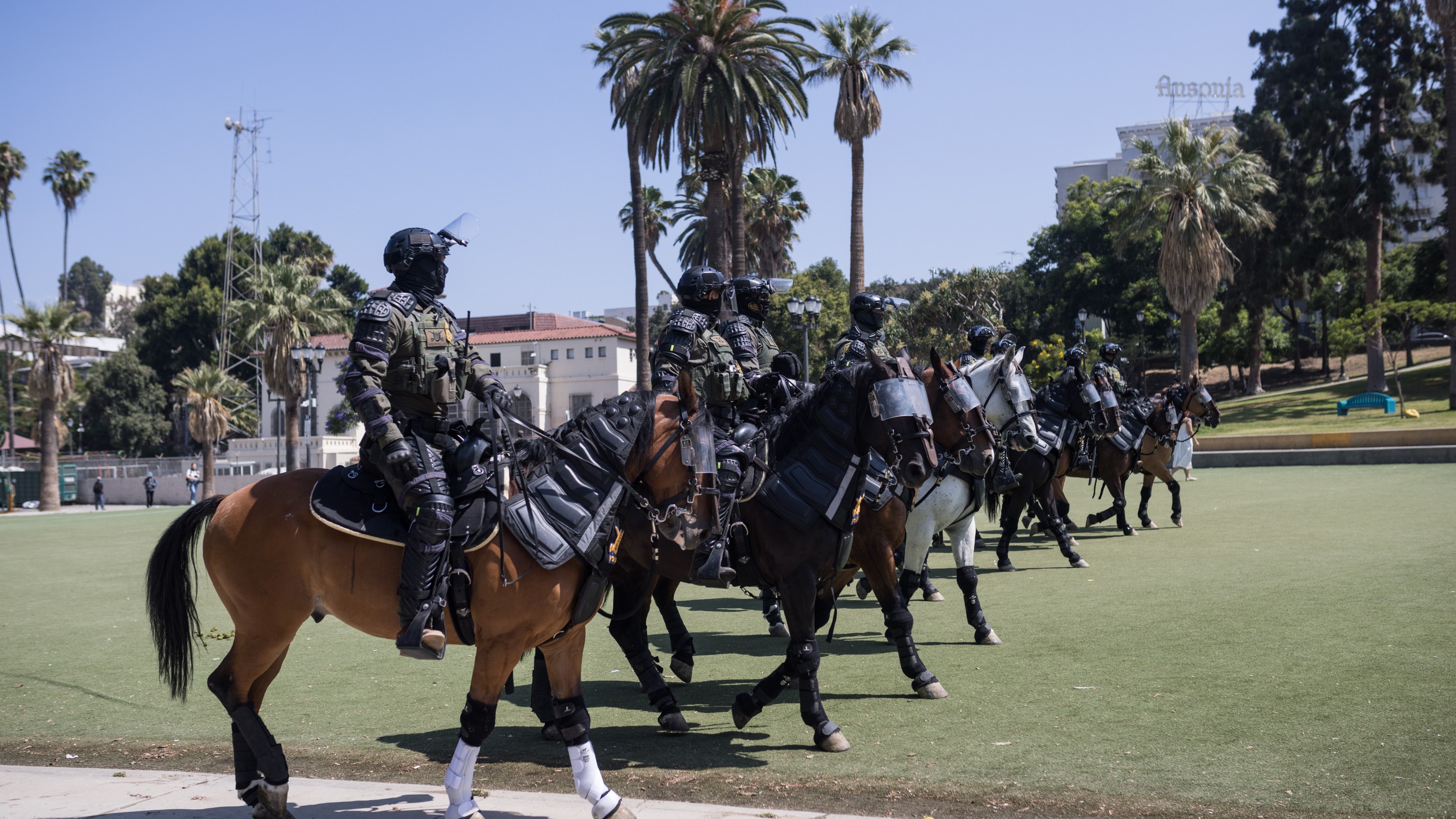 Armed federal agents on horseback at MacArthur Park