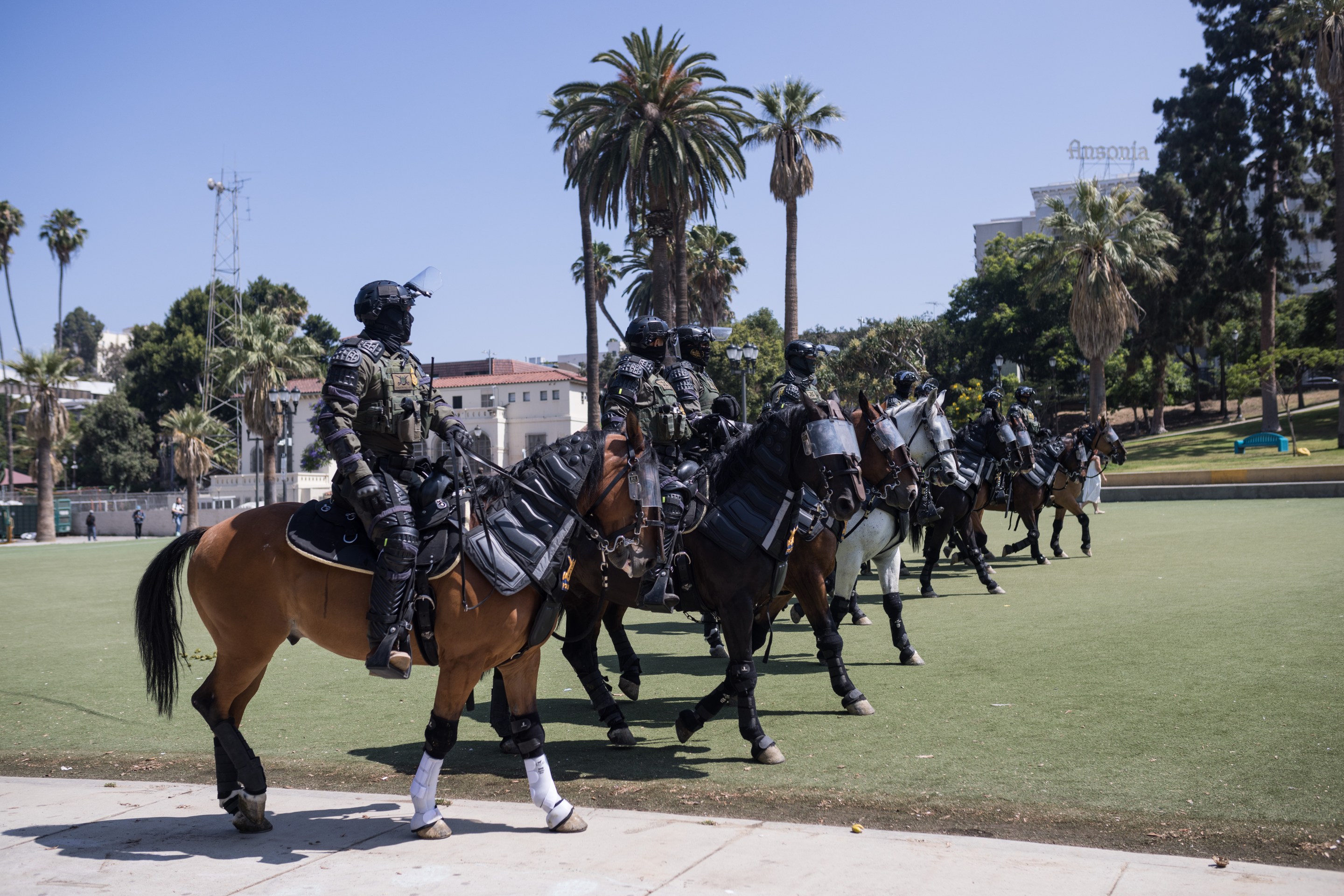 Armed federal agents on horseback at MacArthur Park