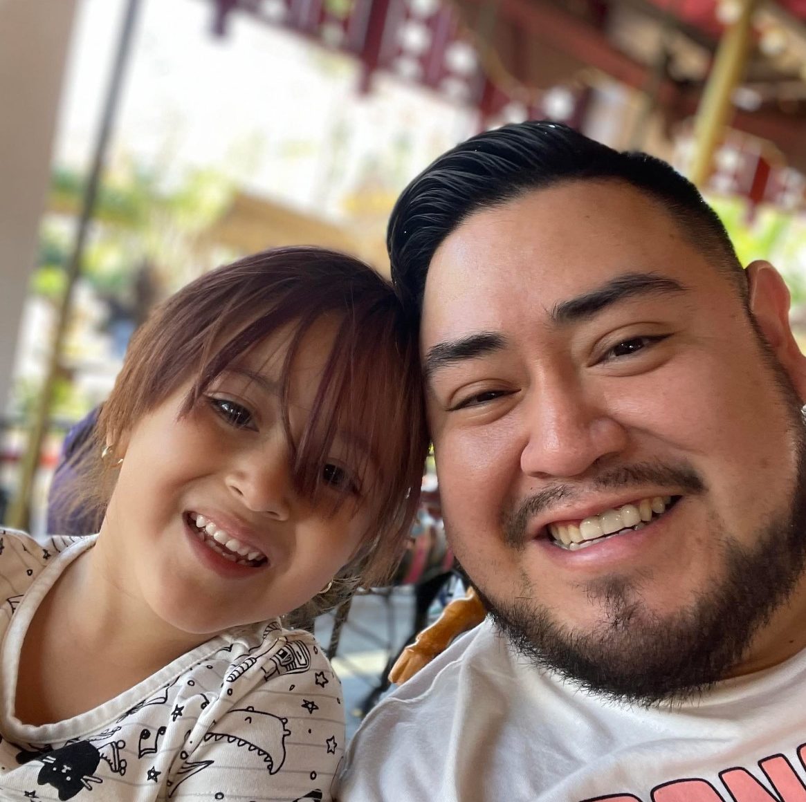 Javier Ramirez posing with his daughter.