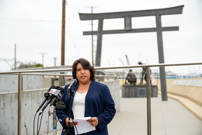 Maya Suzuki Daniels, a member of San Pedro Neighbors for Peace and Justice, speaks at a press conference at Terminal Island on June 27 (Photo by Nikkei Progressives).jpg