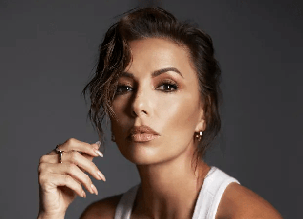 Actress Eva Longoria in a whit tank top