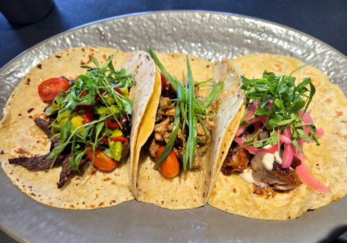 3 Filipino tacos at Pork & Spoon, open-faced on a plate