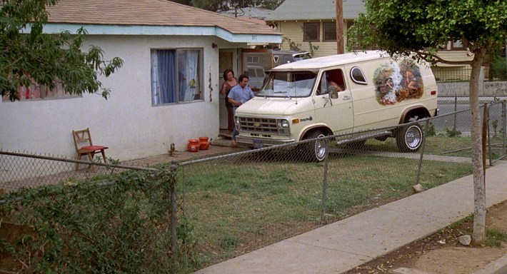 Cheech and Chong crash into a front yard. Screenshot via Universal Pictures.