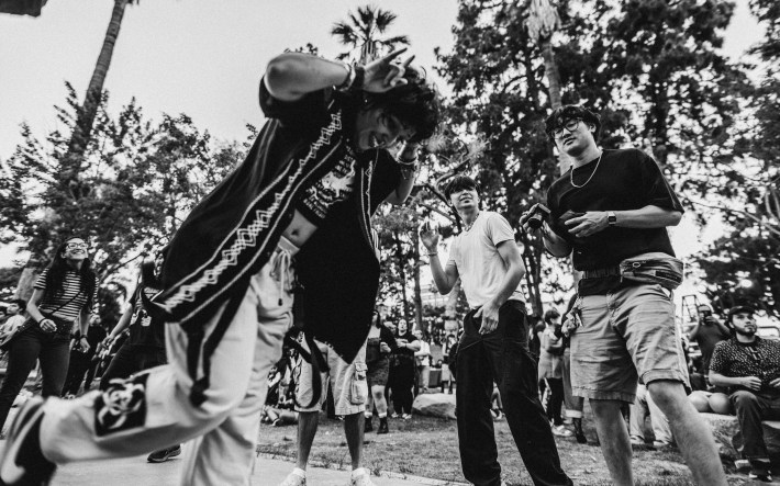 The crowd dances as Lxs Cochinxs performs in MacArthur Park on August 16, 2025.