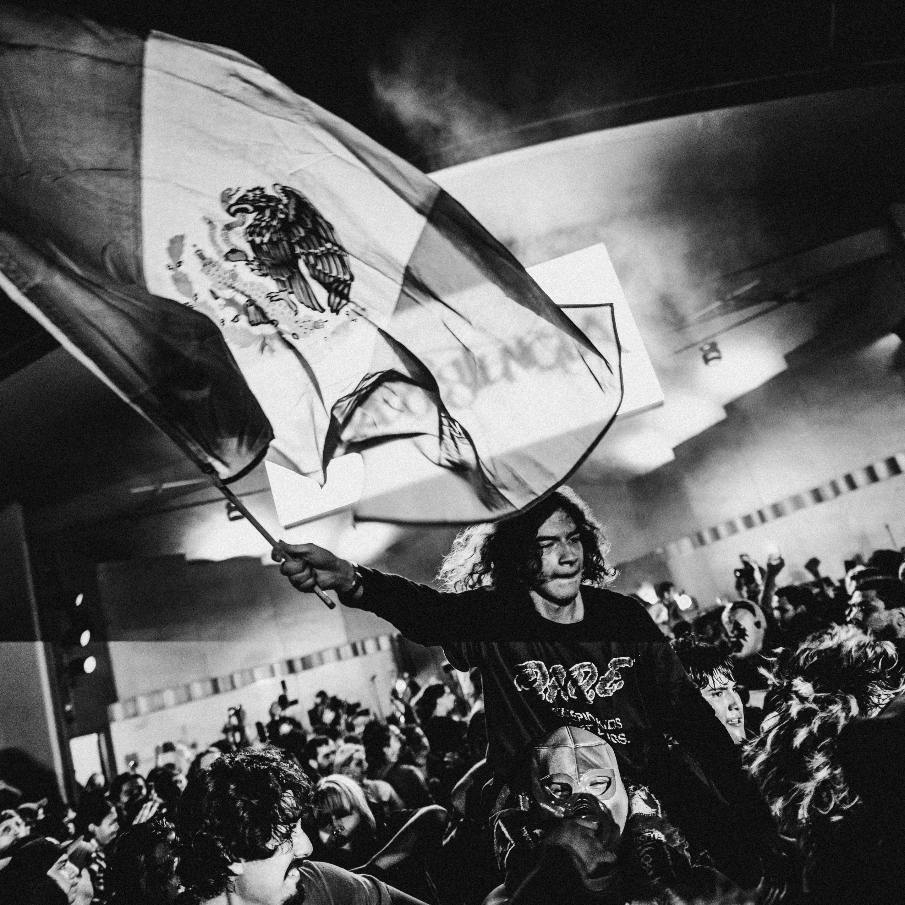 The crowd dances and moshes as La Resistencia performs in MacArthur Park on August 16, 2025.