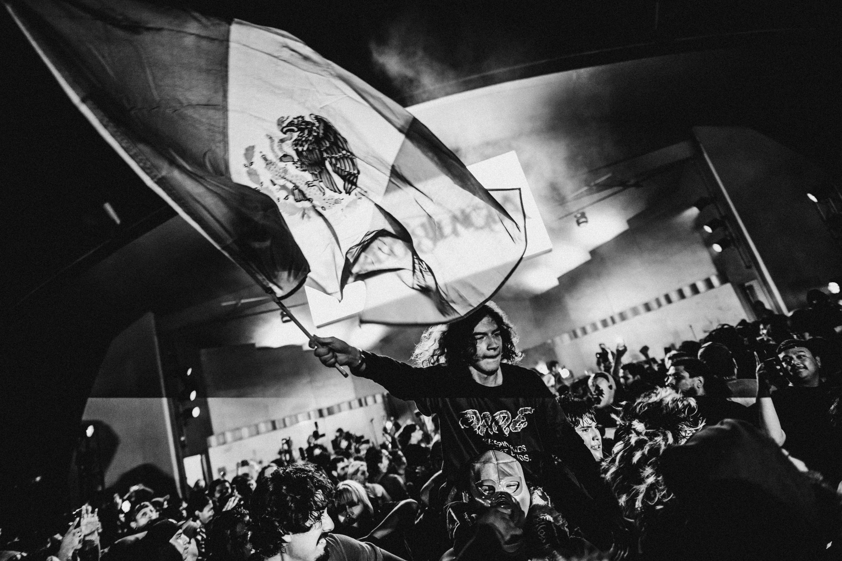 The crowd dances and moshes as La Resistencia performs in MacArthur Park on August 16, 2025.