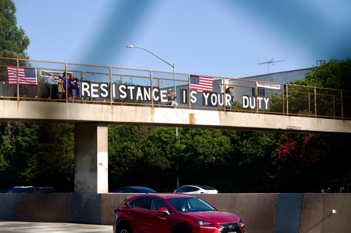 "resistance is your duty" sign over the 101 freeway