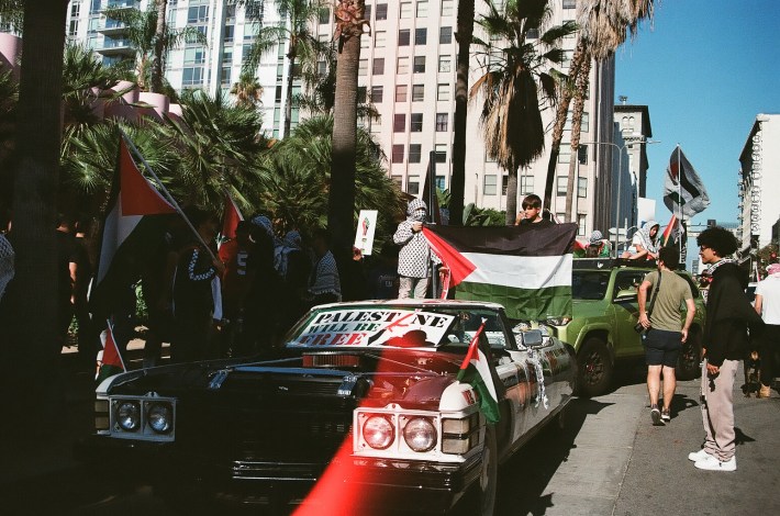 A lowrider decked out in colors of Palestinian flag.