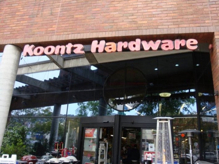 A photo of the outside of Koontz Hardware showing its neon sign.