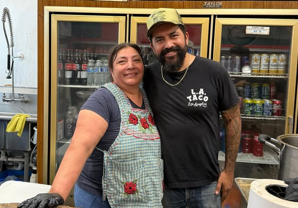 BarBakush's Petra Zavaleta with Aaron Melendrez of Uptown Provisions standing together in a hug