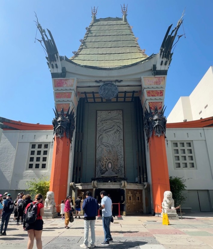 Tourists visit the historic Chinese Theater on the Hollywood Walk of Fame