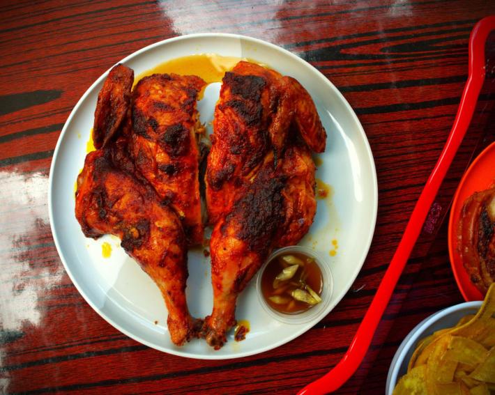 Recado-roasted chicken on a white plate