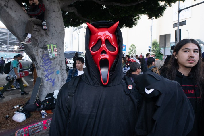 someone wearing a red mask with devils
