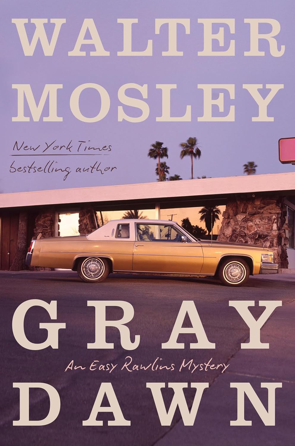 A book cover of "Gray Dawn" by Walter Mosley. It depicts an old-fashioned car in front of a building resembling a motel. There is a light purple sunset and palm trees in the background.