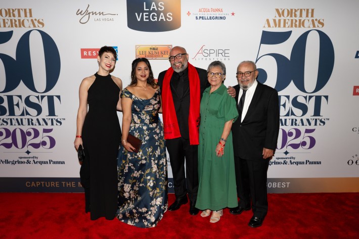 Gilberto Cetina and his family posing at the 50 best awards ceremony.