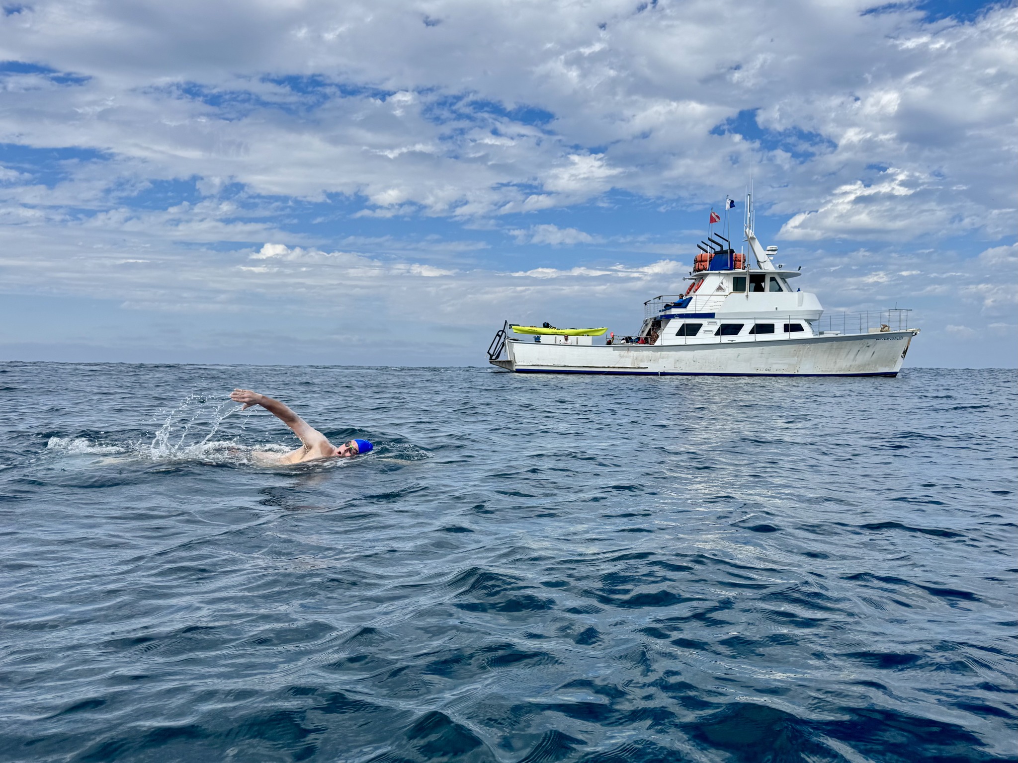Matthew Biancaniello swimming across the water.