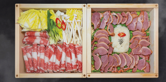 Box sets of brisket and smoked duck at a Korean restaurant
