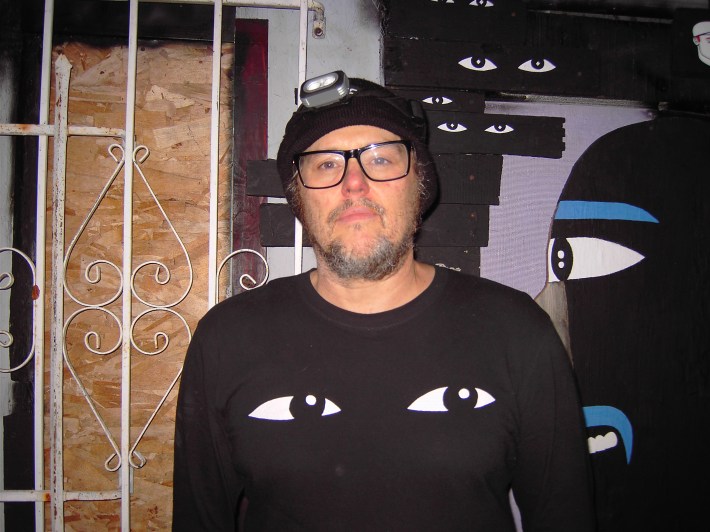 A man looks into the camera