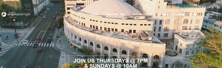 The homepage of the Angelus Temple website showing their facility which is a ginormous beige building.