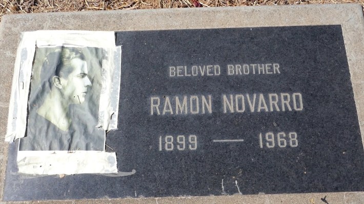 A gravestone reads "Beloved Brother. Ramon Novarro. 1899-1968." A photo of a young man is also part of the gravestone.