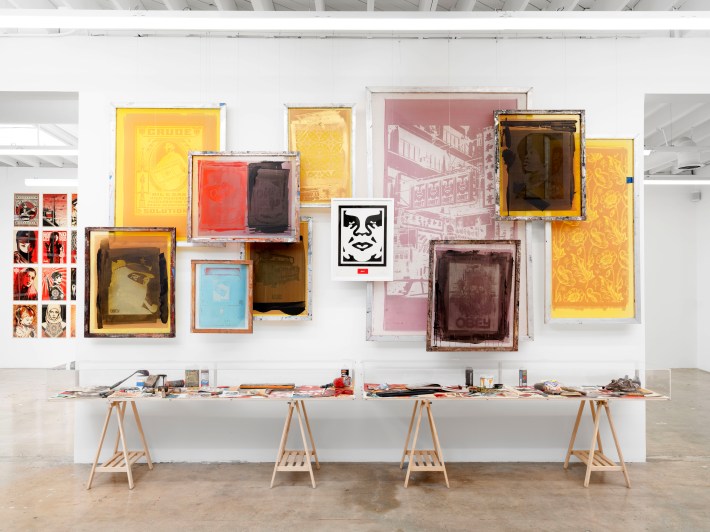 art hanging on a wall, with the OBEY GIANT logo in the middle