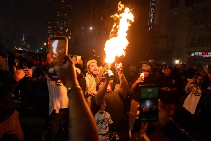 A fire is created from within a crowd