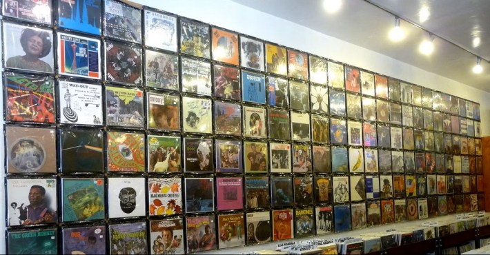 a wall of vinyl record covers